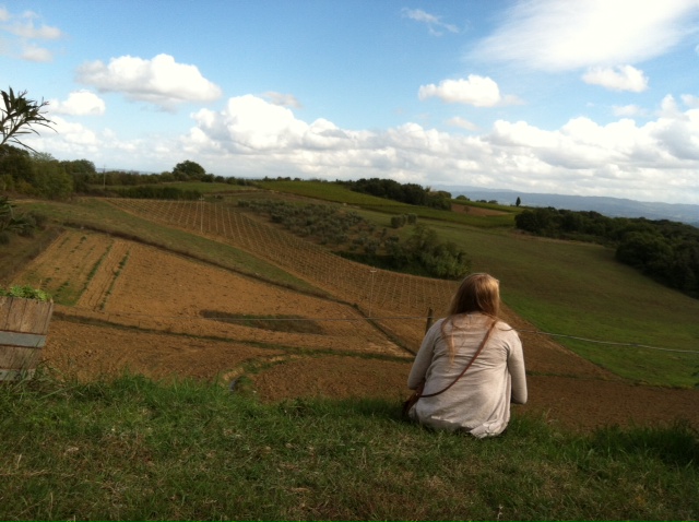 girl sitting in field